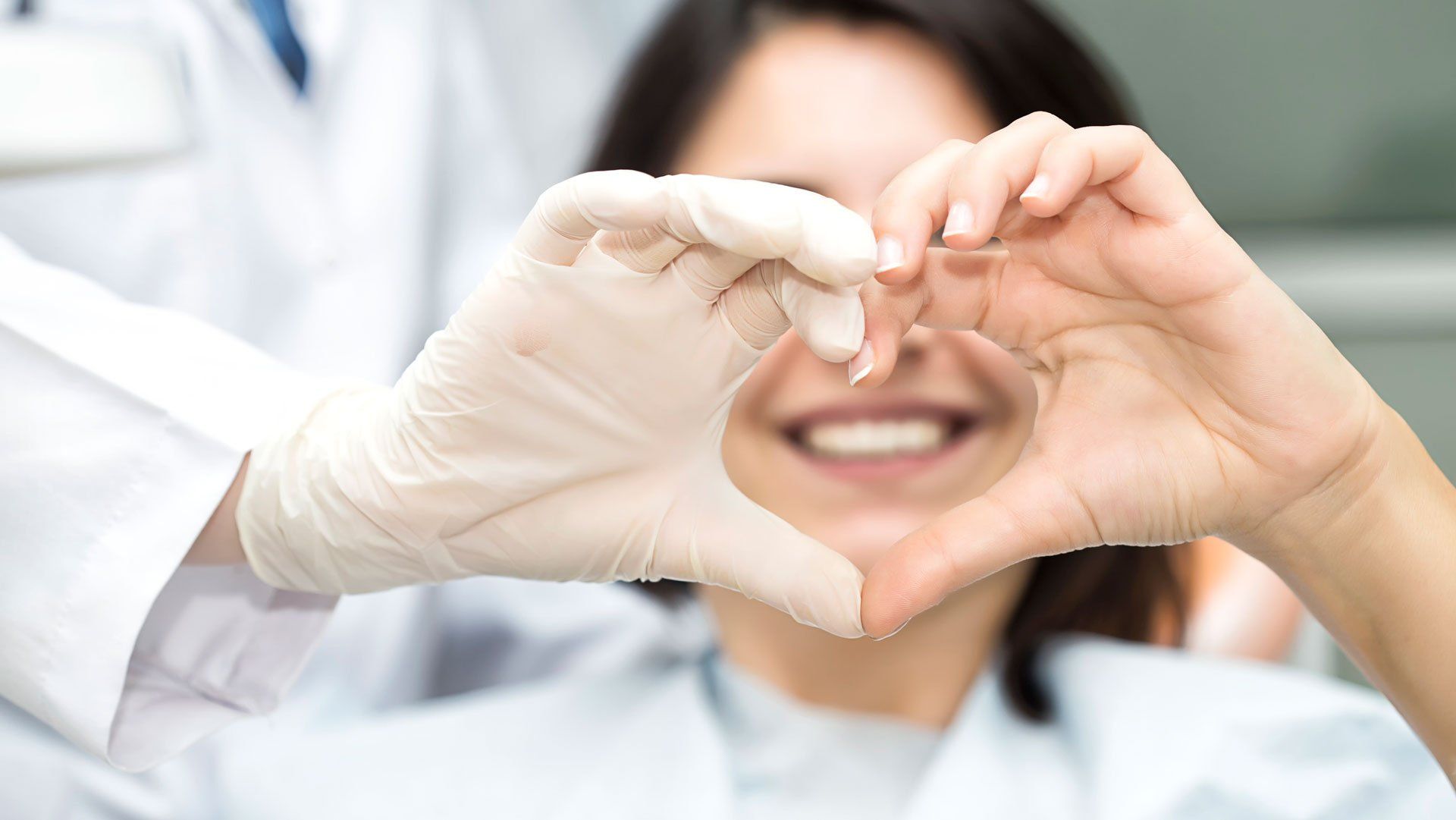Patient and Dentist Doing Hand Heart — Joelton, TN — Wingo Family Dentistry