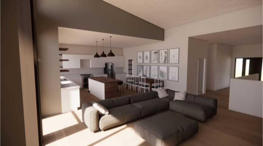 A living room with a couch and a kitchen in the background