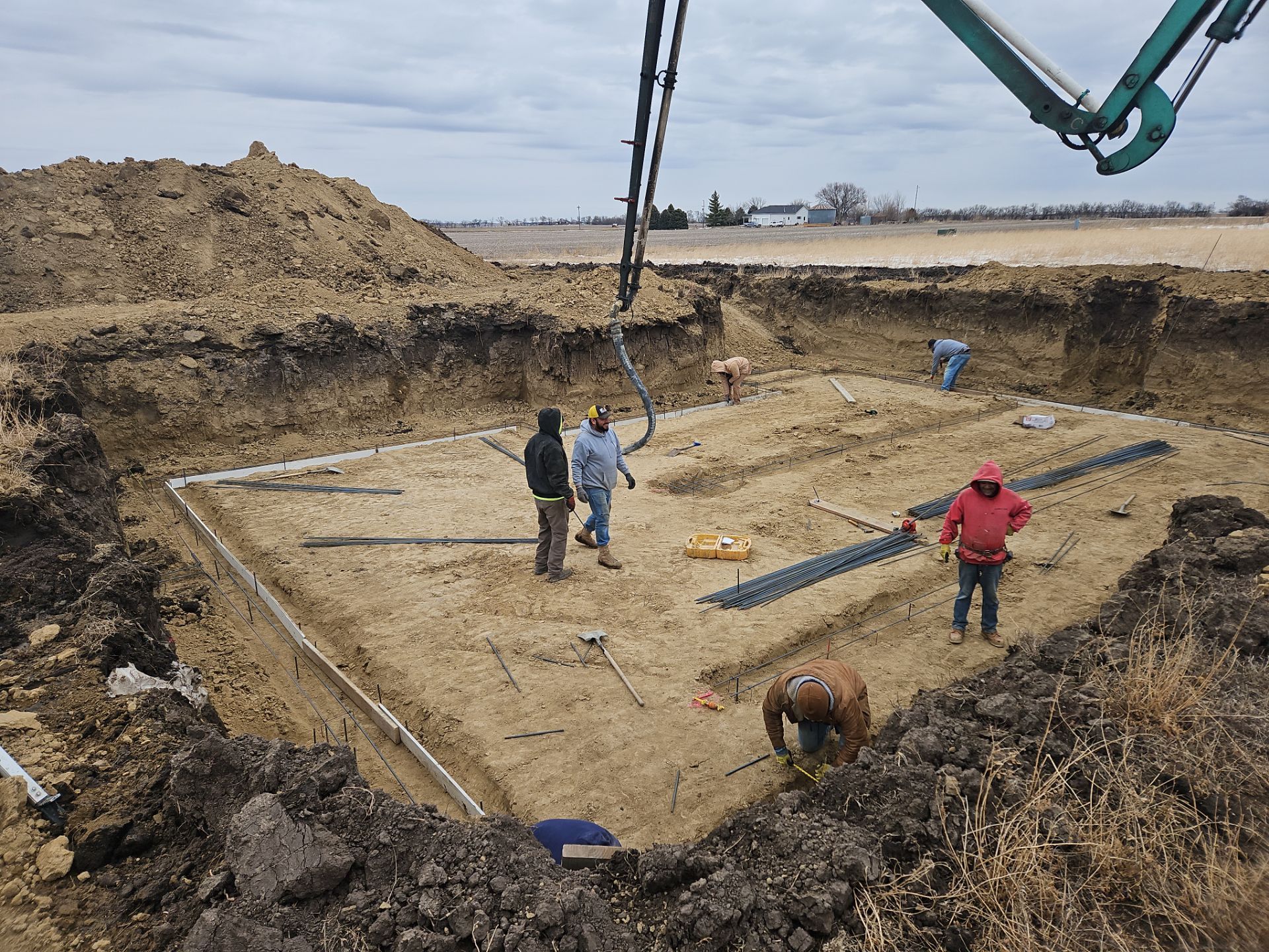 A group of construction workers are working on a construction site.