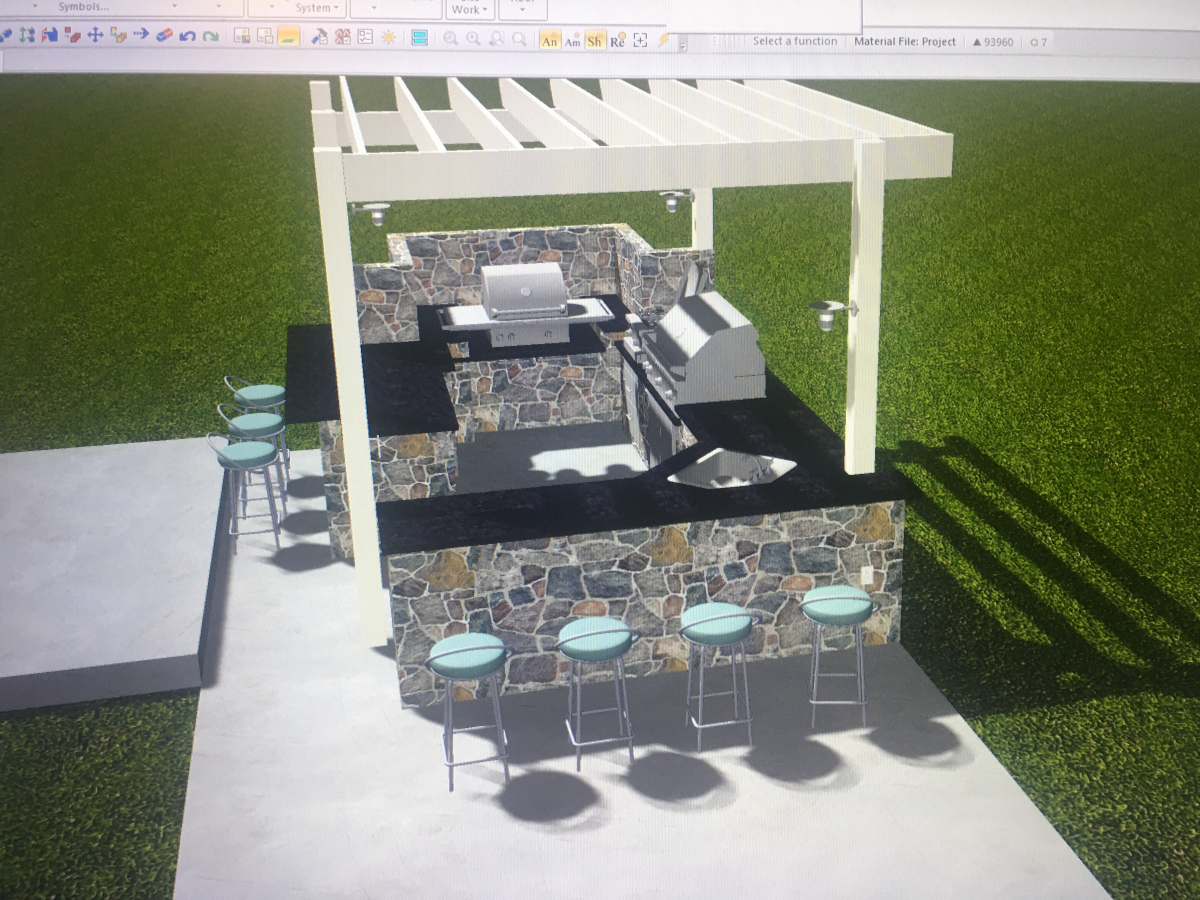 Outdoor kitchen with stone facing, pergola, grill, and bar stools on a concrete patio.