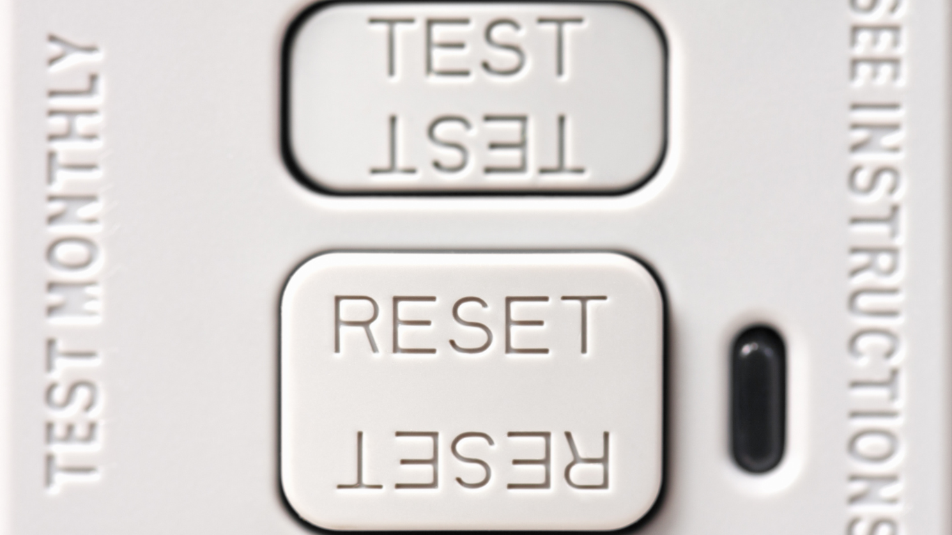 A close up of a test monthly reset button