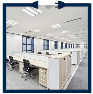 A large office with a lot of desks and chairs.