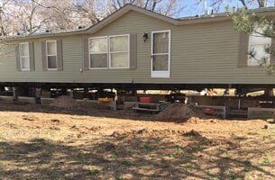 Green House Preparing to be Moved — House Lifting in Moundridge, KS