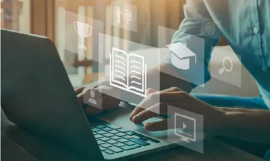 Um grupo de estudantes de medicina está olhando para um laptop.