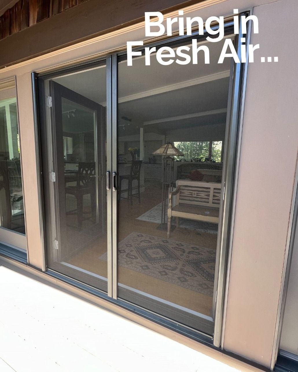 Sliding glass doors open to a patio, with text reading βBring in Fresh Air...β