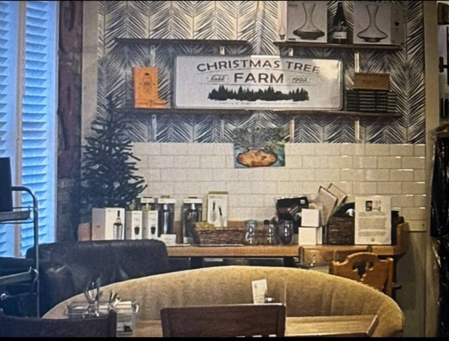 A room with a sign that says christmas tree and farm