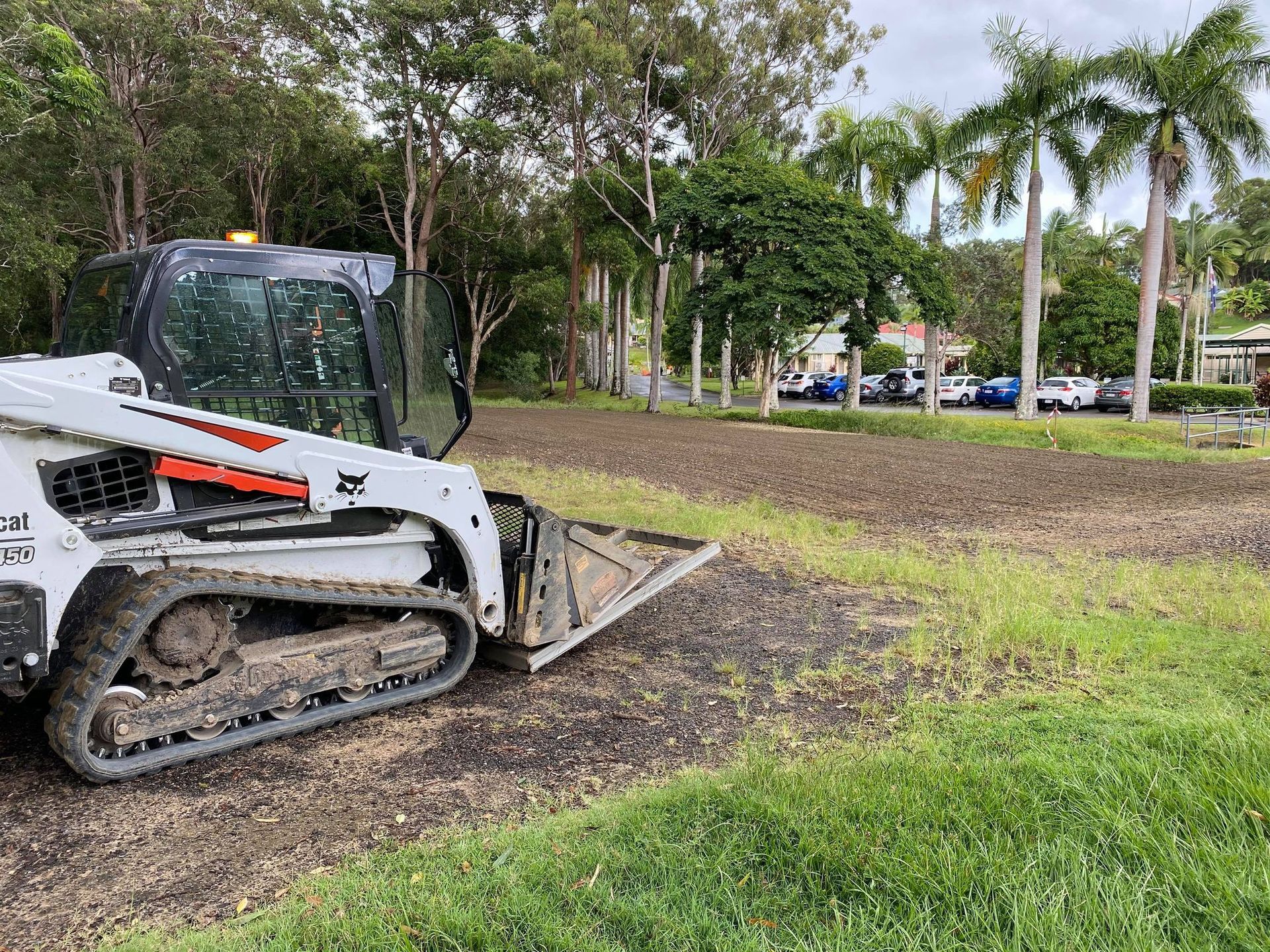 A Bulldozer is Sitting on Top of a Soccer Field — Caloundra Landscape Supplies in Caloundra, QLD