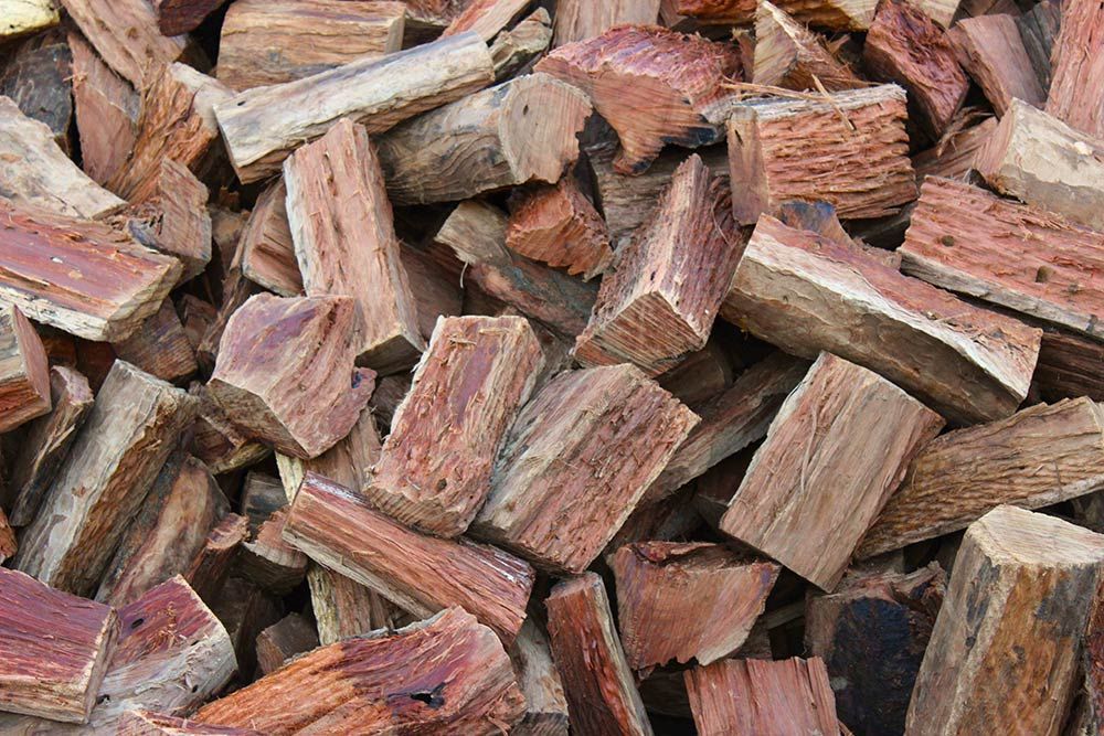 A Pile of Wood is Sitting on a Table — Caloundra Landscape Supplies in Caloundra, QLD