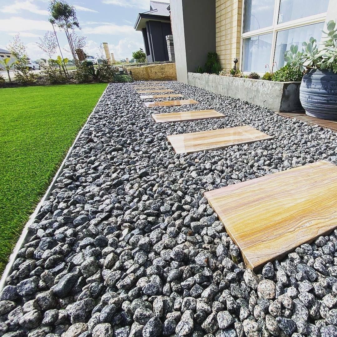 A Black Link Edge With a Hole in the Middle on a White Background — Caloundra Landscape Supplies in Caloundra, QLD