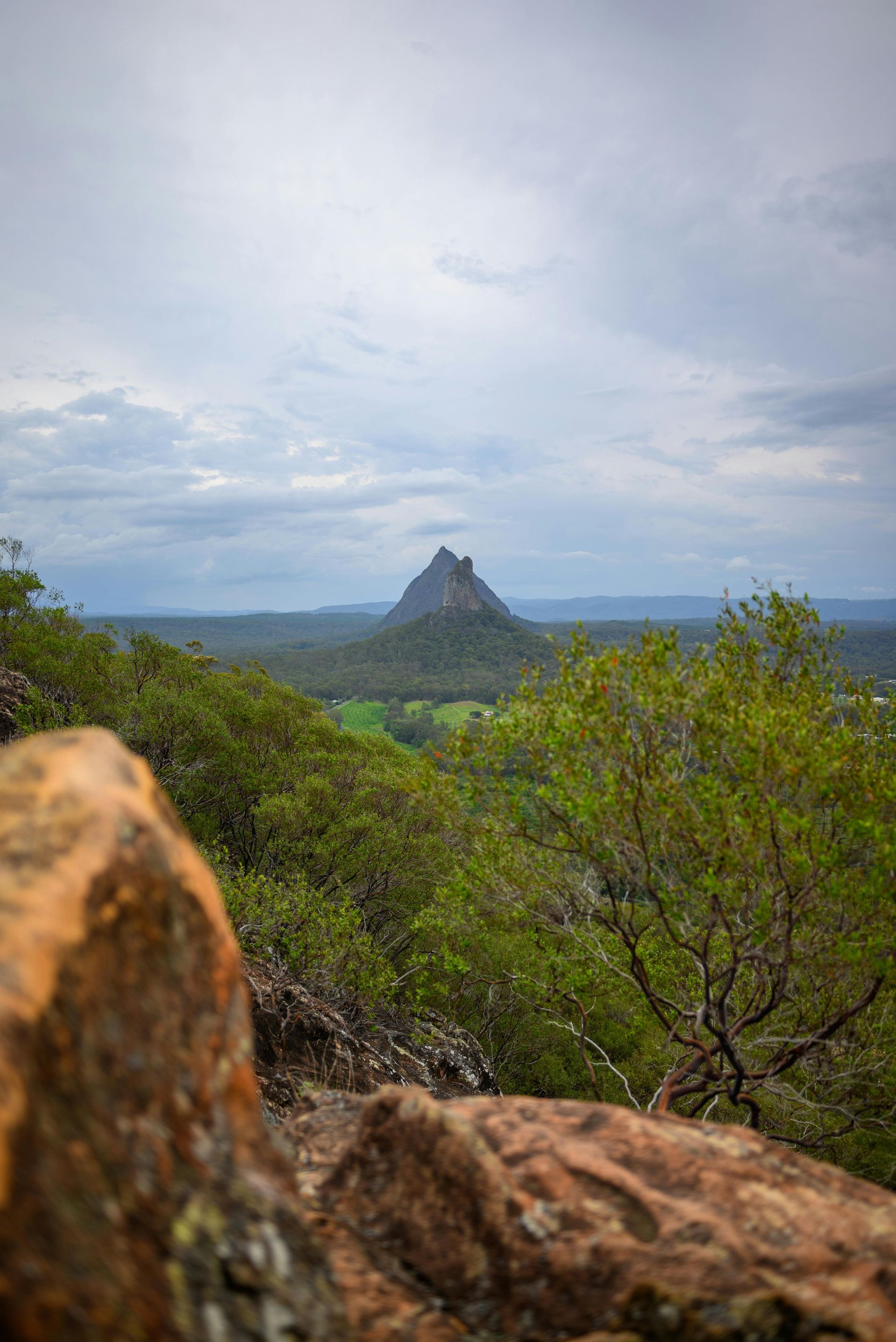 A Highway With a Mountain in the Background and Cars Driving Down It — Caloundra Landscape Supplies in Beerwah, QLD