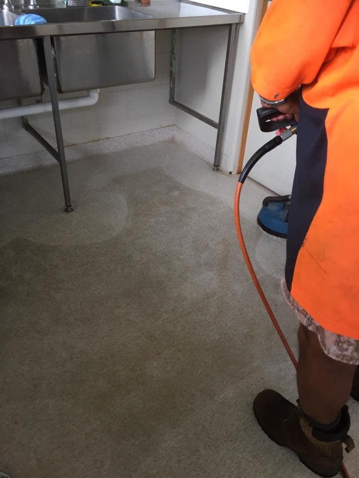 Person in Orange Jacket Cleaning — NQW Services In Ayr, QLD