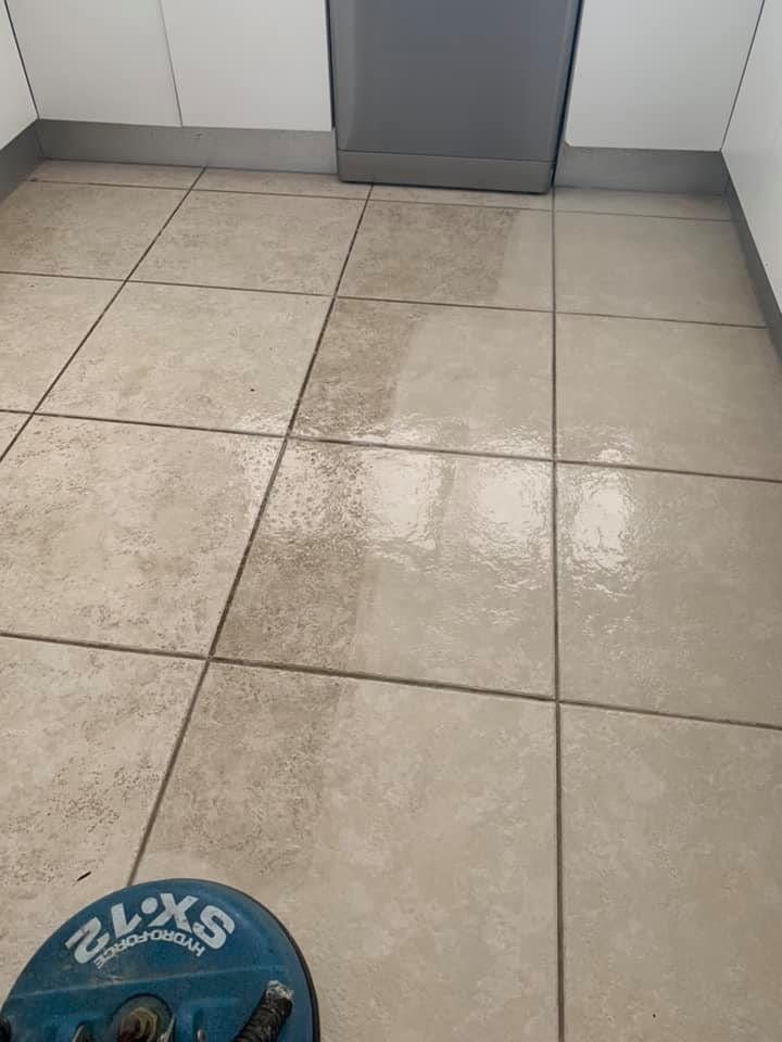 A Tiled Floor in a Kitchen With a Cleaning Machine on It — NQW Services In Cardwell, QLD