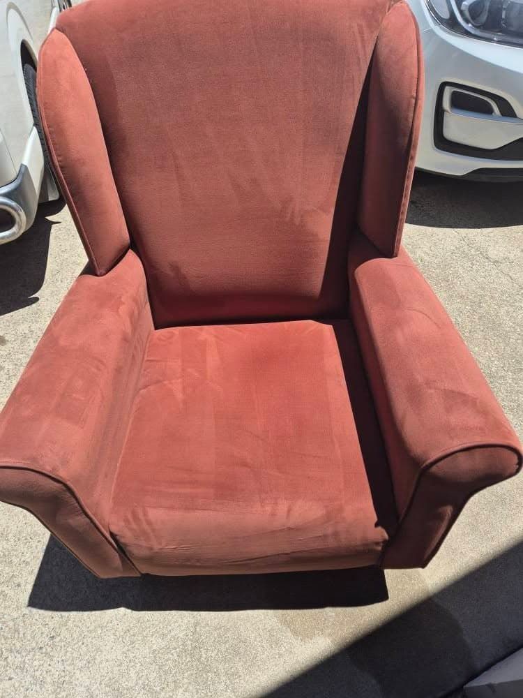 A Red Chair is Sitting in Front of a White Car — NQW Services In Cardwell, QLD
