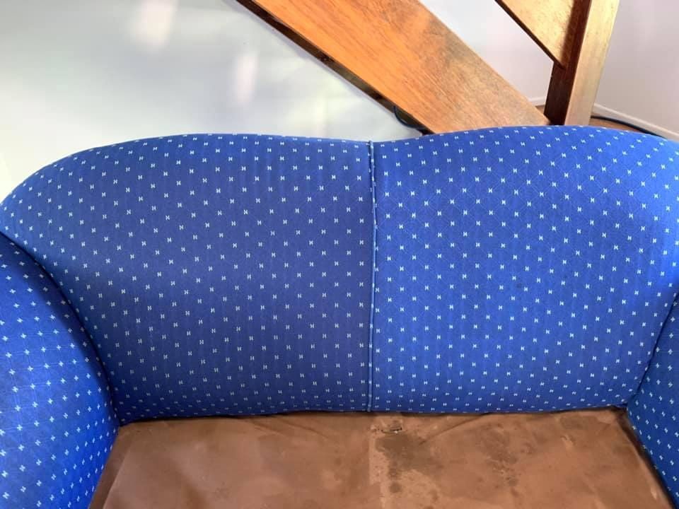 A Blue Polka Dot Couch With a Wooden Staircase in the Background — NQW Services In Ingham, QLD