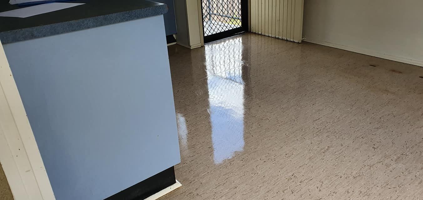 A Living Room With a Marble Floor and a Blue Counter Top — NQW Services In Cardwell, QLD