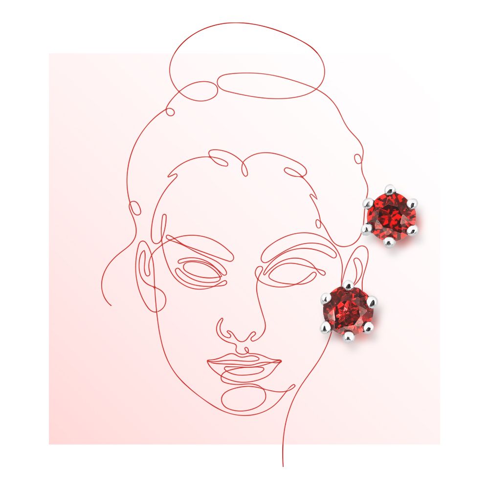 一對耳釘，每隻耳釘上都鑲嵌著一顆圓形紅色寶石，寶石鑲嵌在銀色六爪底座上，背景為白色。