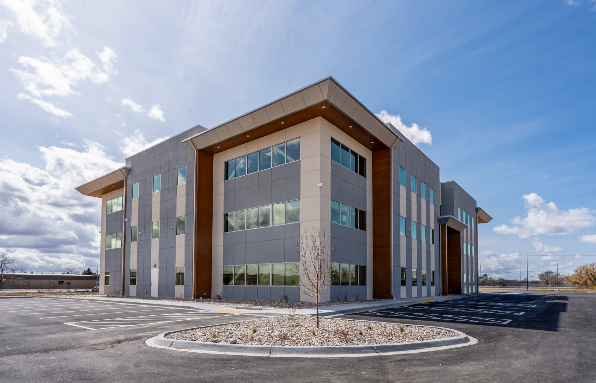 Ground view of three story Fluor Marine Propulsion building at an angle.