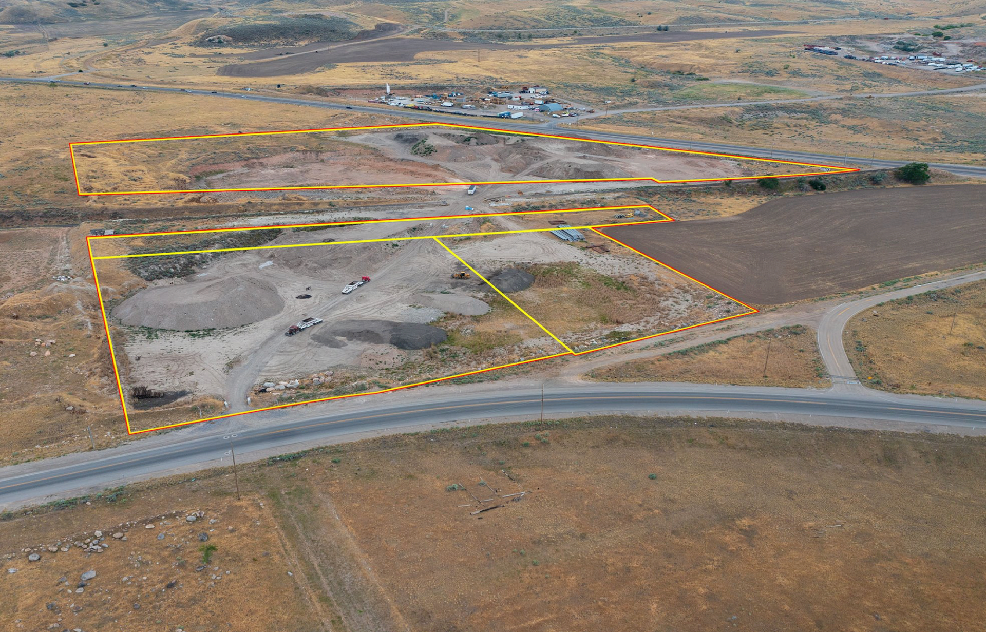 Aerial view of The Grove Industrial plot of land with digital plot lines of the location overlaid.