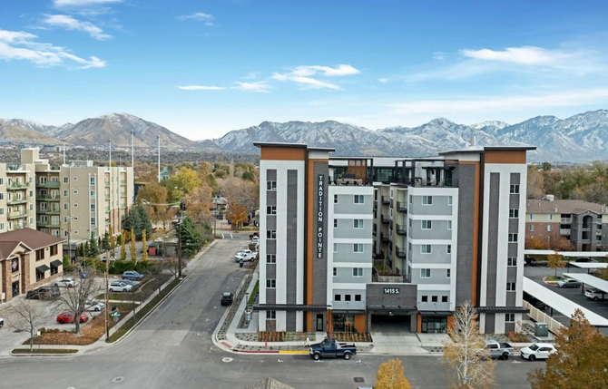 Aerial view of Tradition Pointe building with the mountains in the background.
