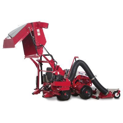 A red lawn mower with a black hose attached to it using the Vacuum System by Ventrac