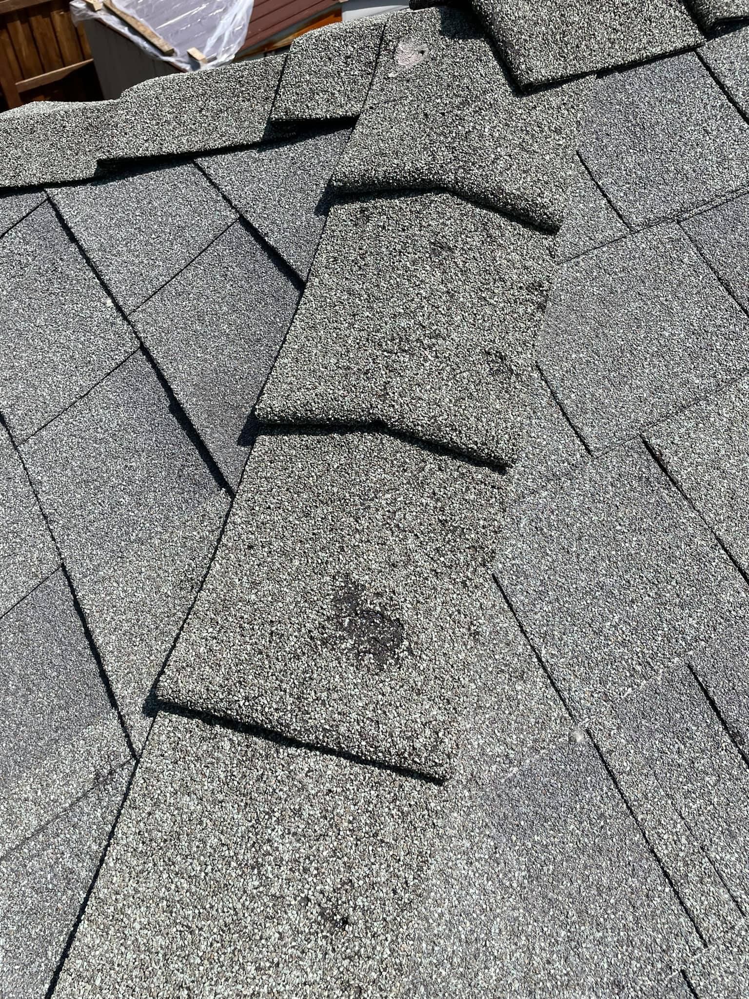 A close up of a roof with shingles on it.