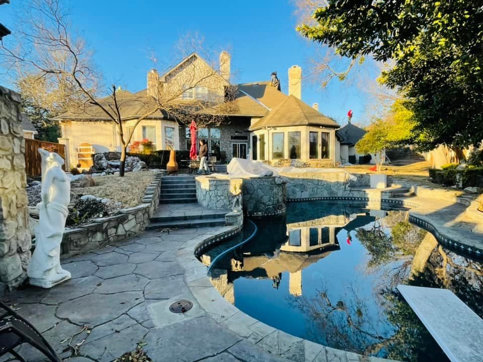 A large house with a swimming pool in front of it