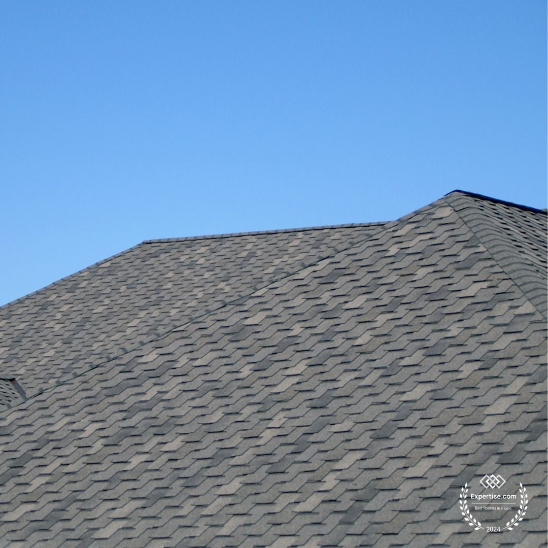 A roof with a blue sky in the background