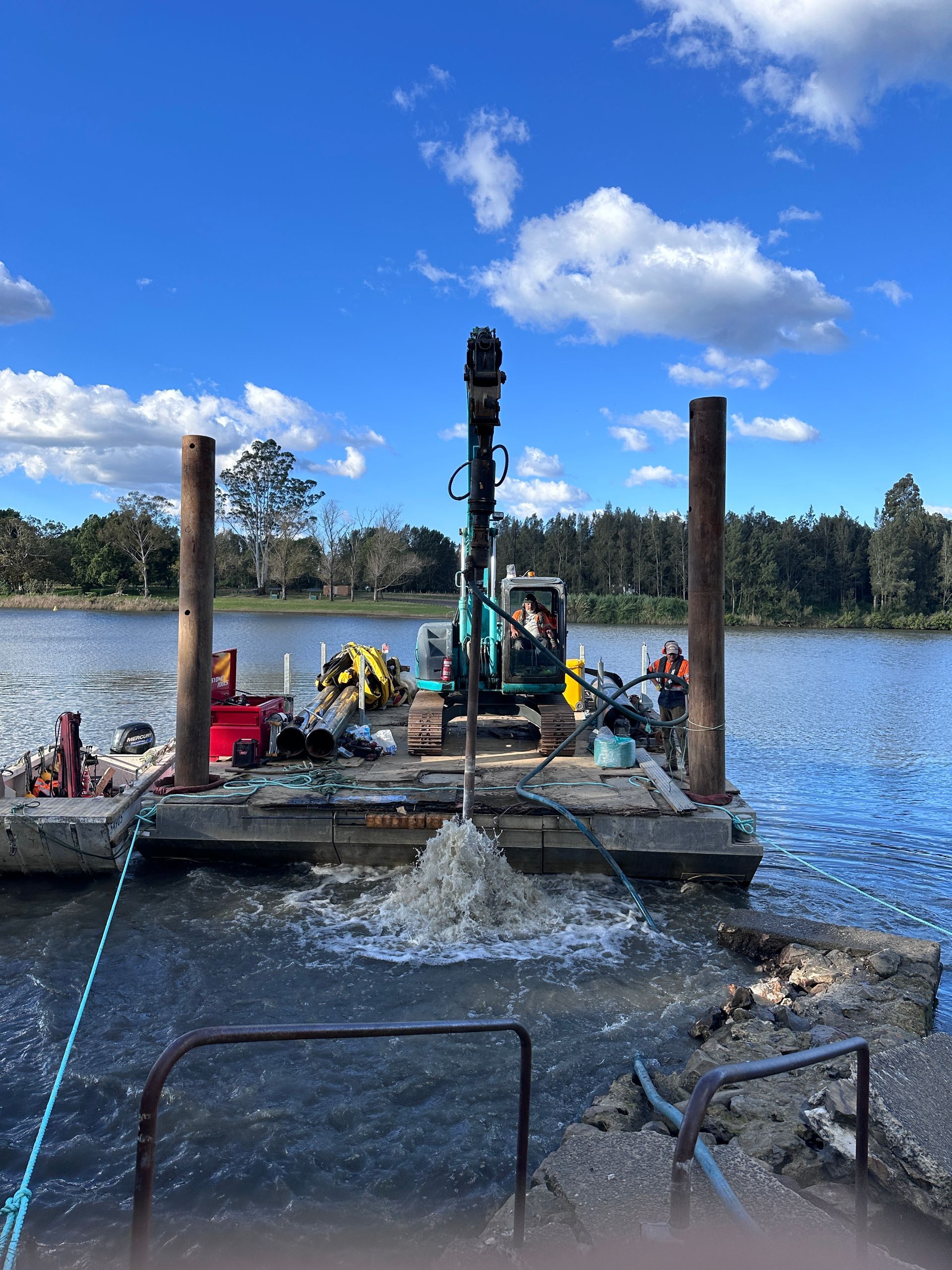 An Excavator on A Floating Platform Works in A Lake — M&J Marine Services in Coffs Harbour, NSW