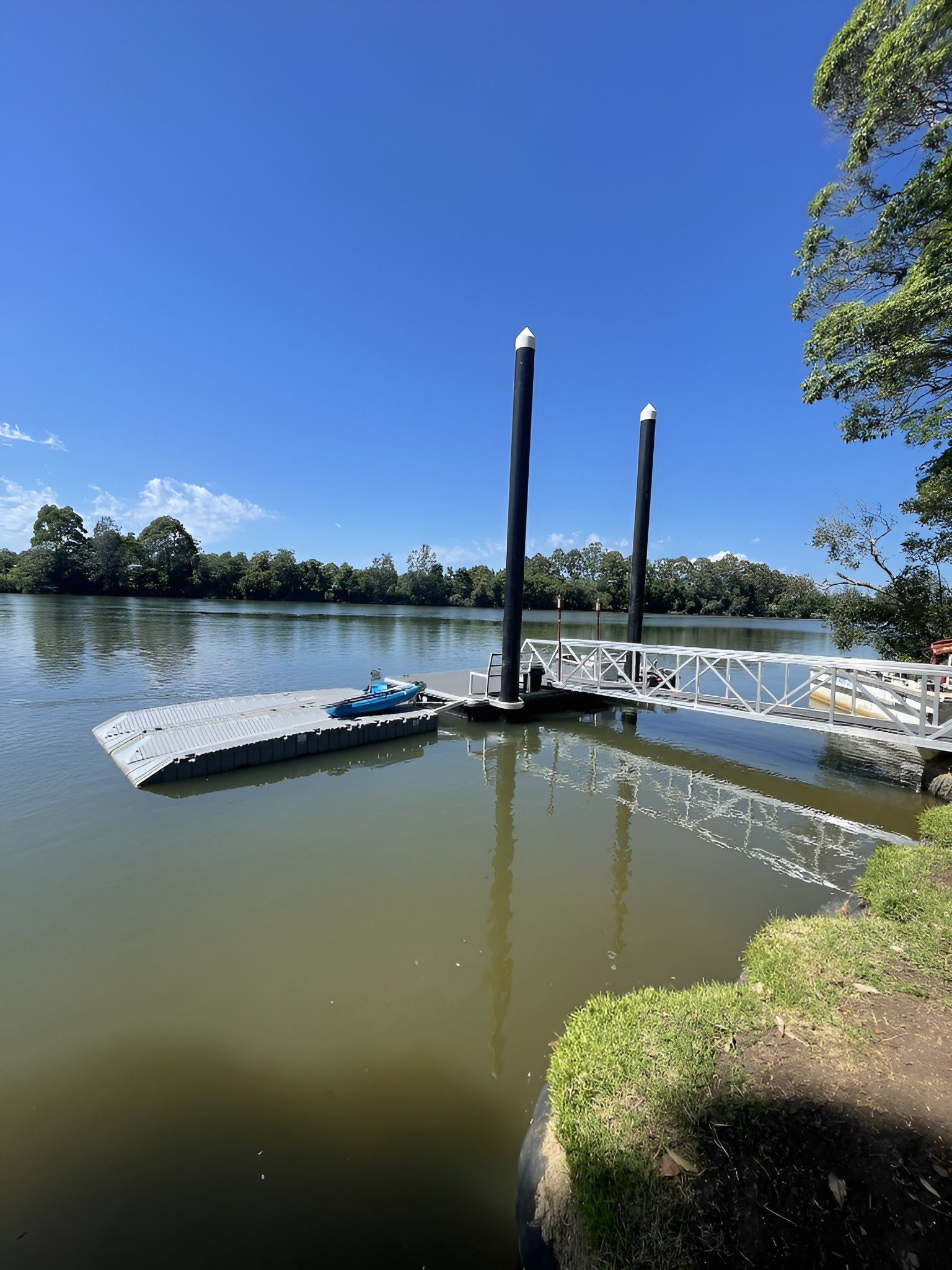 Dock on A River with A Blue Kayak — M&J Marine Services in Lake Macquarie, NSW