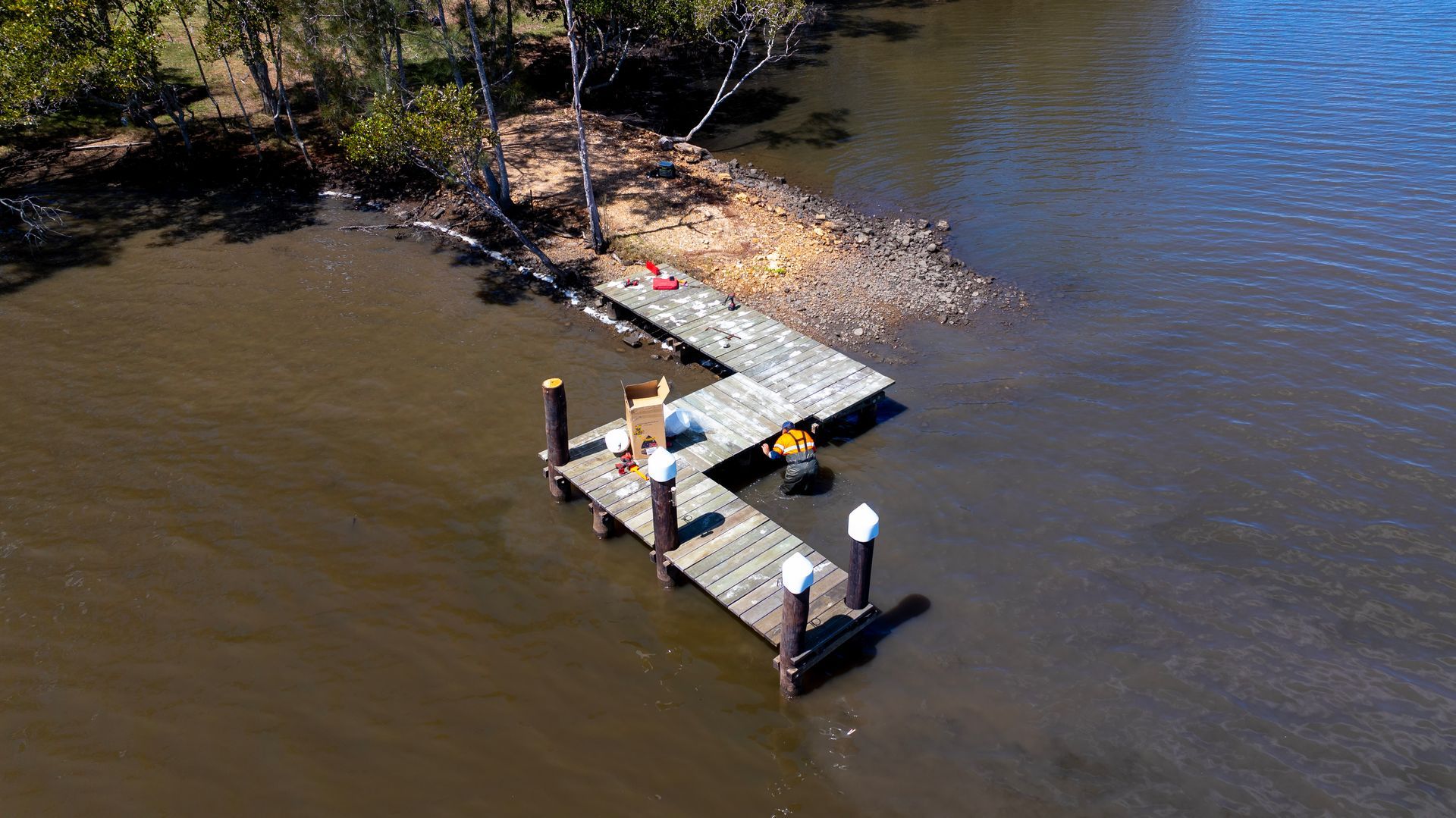 An Aerial View of A Wooden L Shaped Dock — M&J Marine Services in Coffs Harbour, NSW