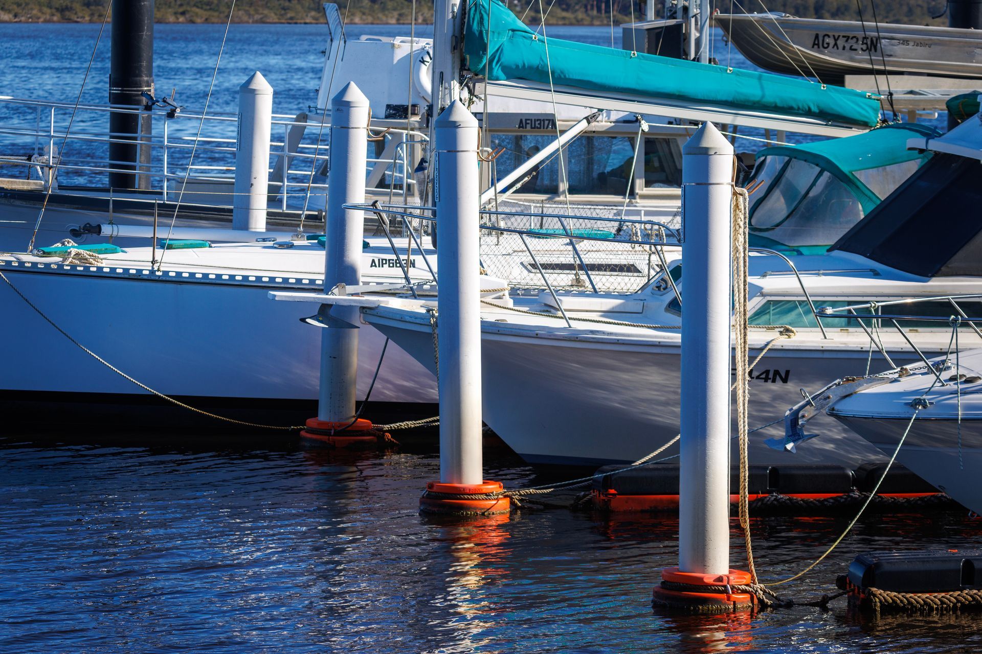 White Boats Docked in A Marina — M&J Marine Services in Newcastle, NSW