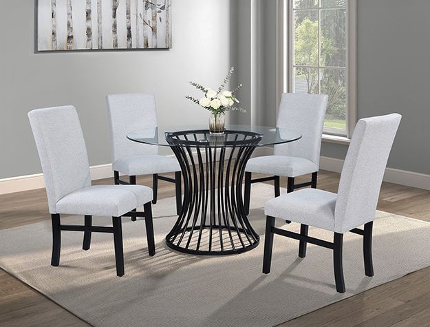 A dining room with a glass table and white chairs