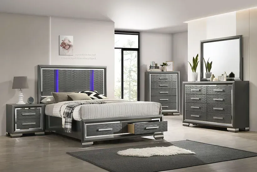 A bedroom with a bed , dresser , nightstand , mirror and rug.