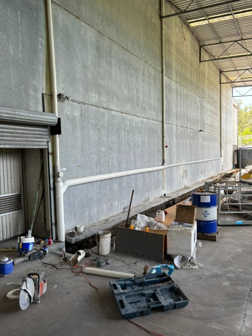 A Warehouse With A Lot Of Tools And Boxes On The Floor — Oceanforce Plumbing In Blacksmiths, NSW