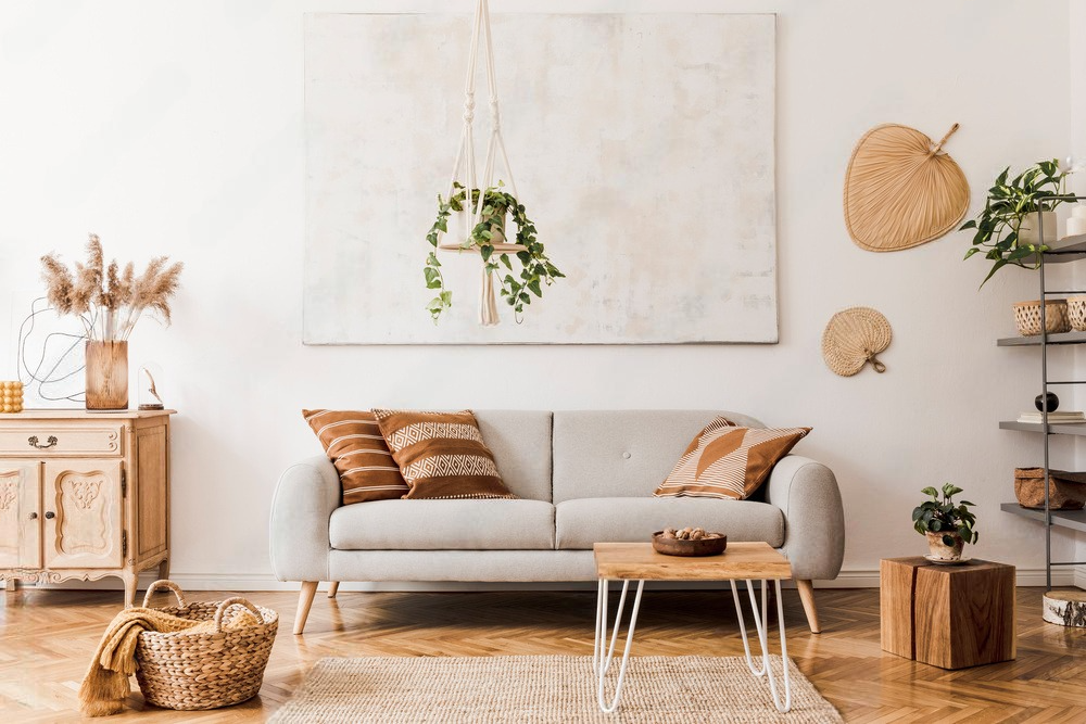 a living room with a couch , coffee table , and a painting on the wall .