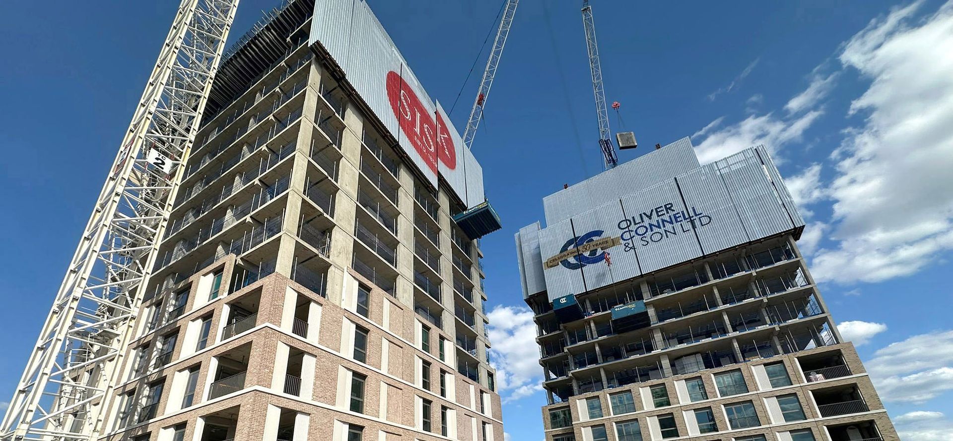 Sisk and Oliver Connell hoardings on building