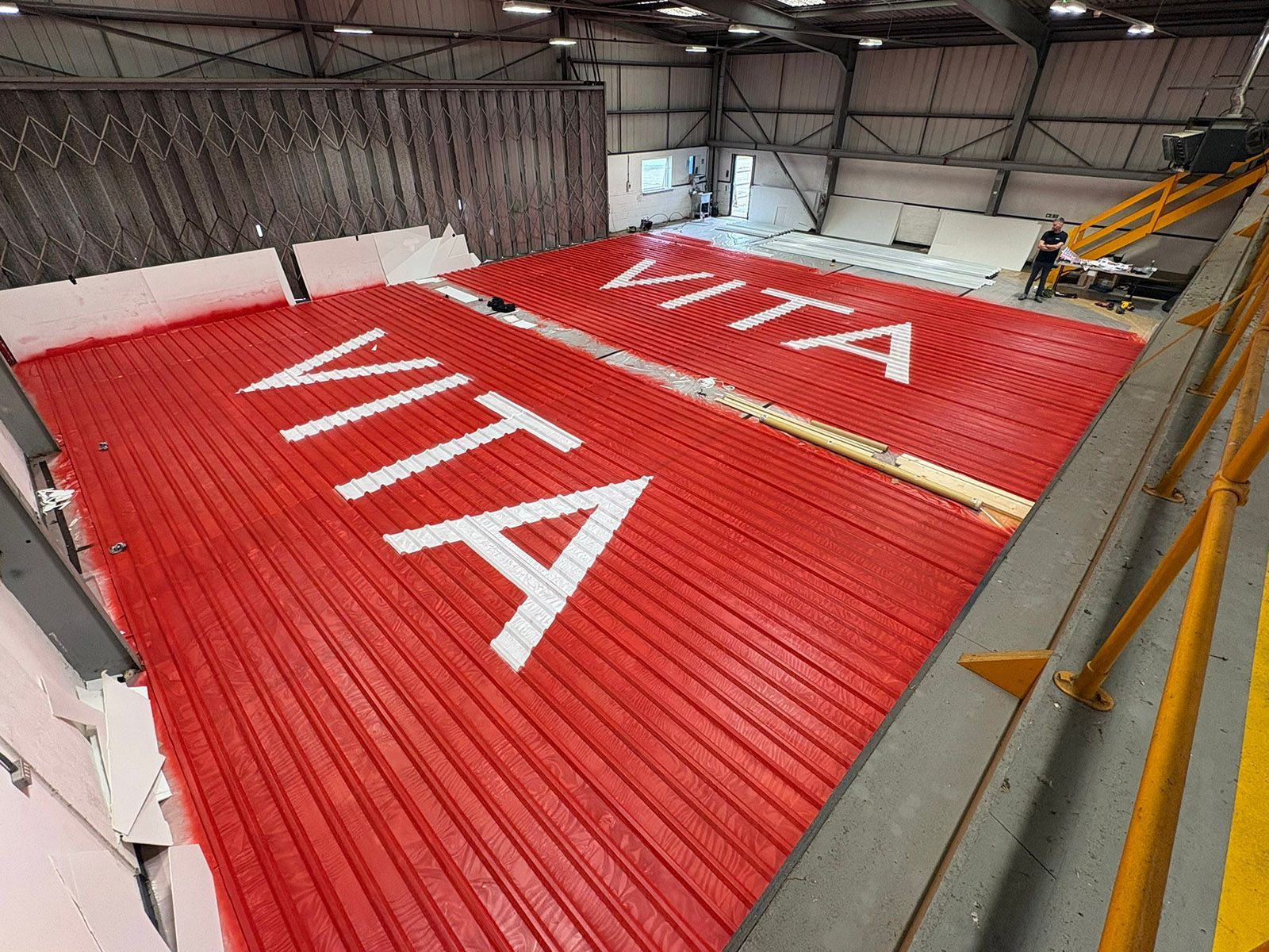 The Large Letter Company VITA logos being painted