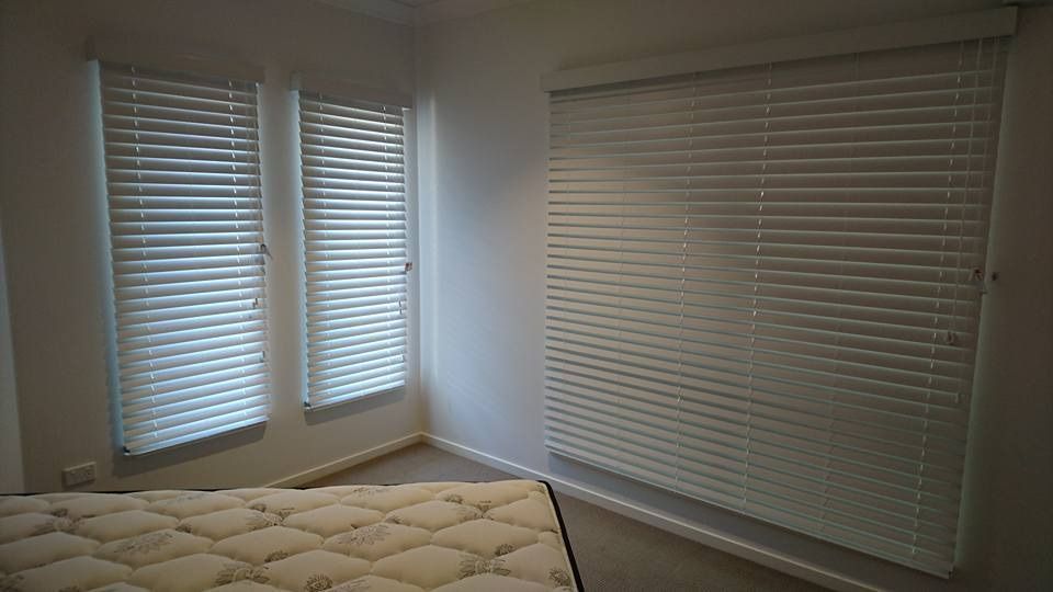 A Room With Closed White Blinds — Instyle Curtains & Blinds in Bungalow, QLD