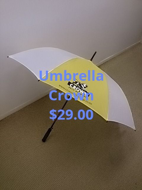 Yellow and white Crown umbrella on beige carpet, priced at $29.00.