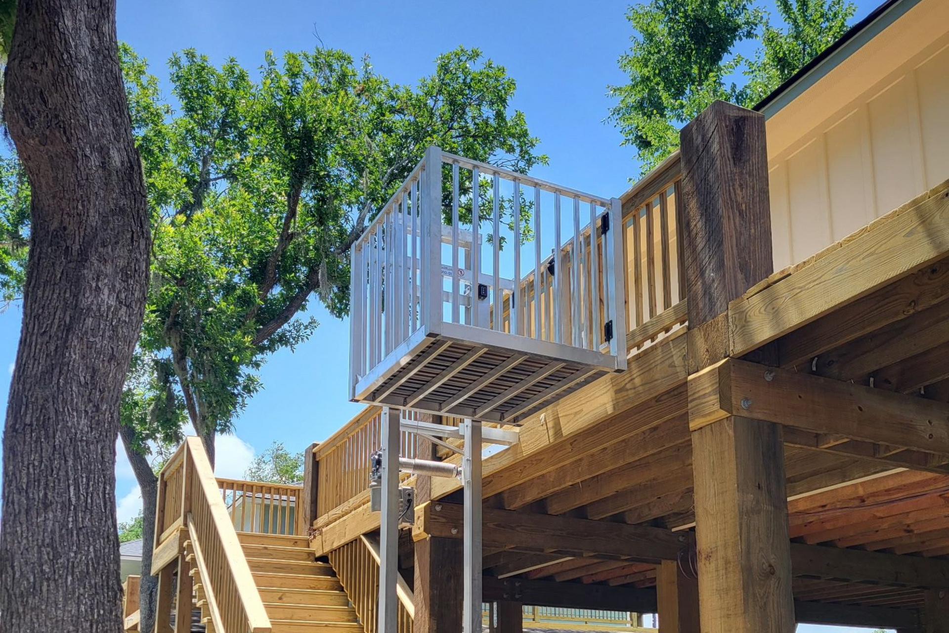 cargo lift installed on a new deck in the raised position
