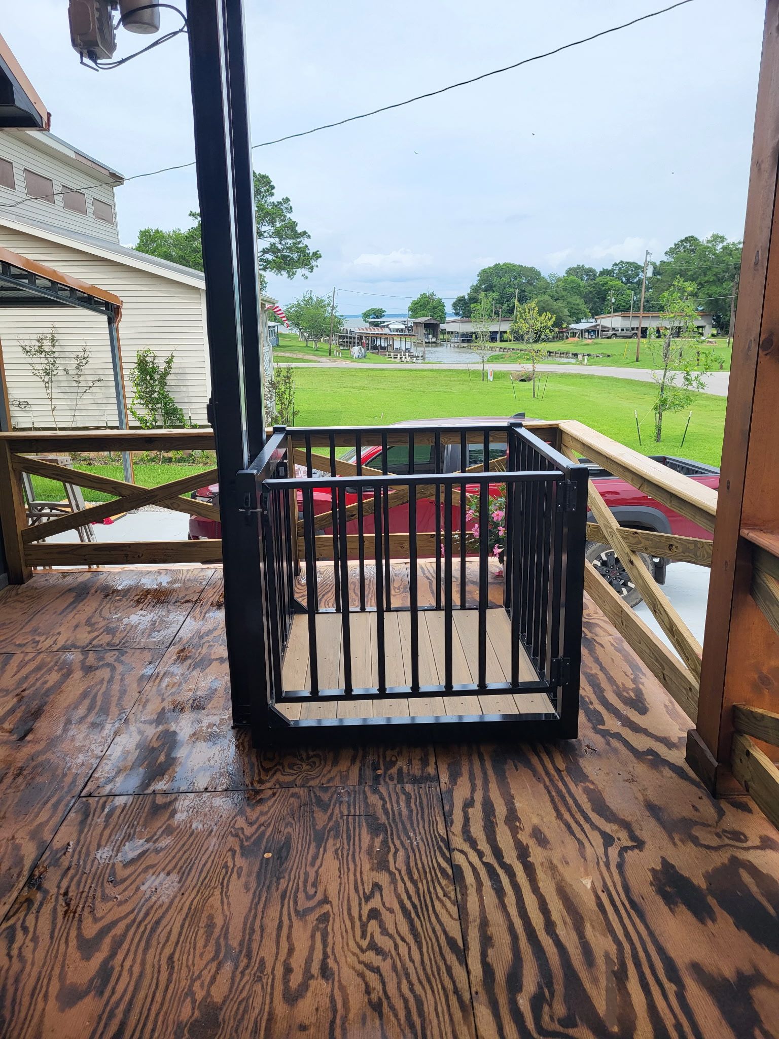 cargo lift installed on the deck of an elevated coastal home