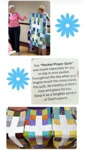 People holding a quilt and a blue flower beside a sign about a “Pocket Prayer Quilt” promoting peace