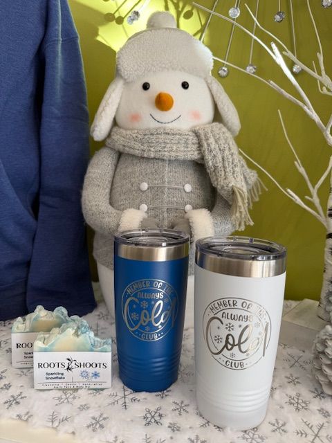 A mannequin wearing a scrub top and a pink hat