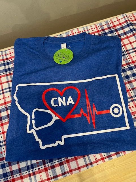 A blue t-shirt that says cna on it