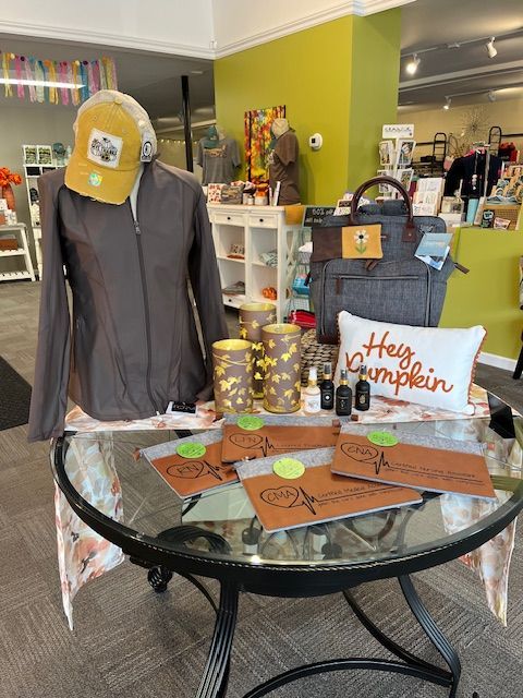 A table with a pillow that says happy pumpkin on it