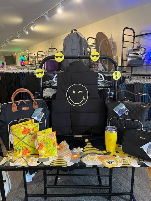 A black vest with a smiley face on it