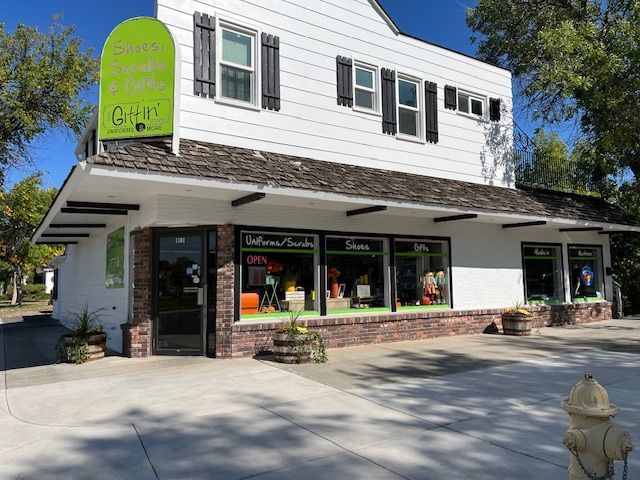 A store front with a fire hydrant in front of it