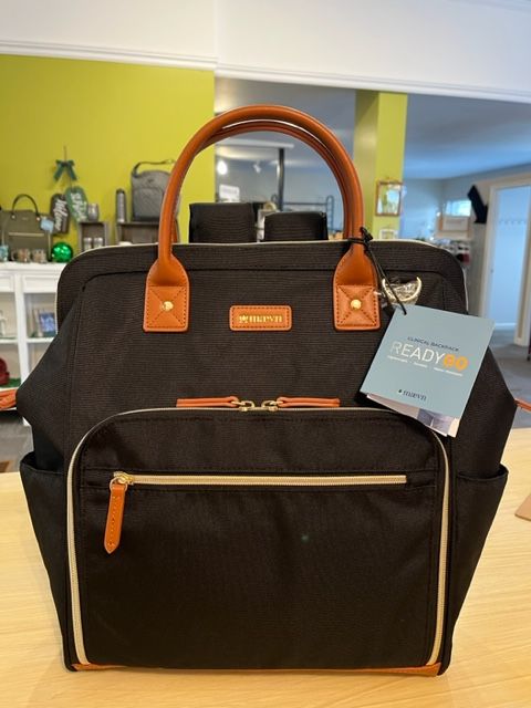 A black bag with a tag that says ready on it