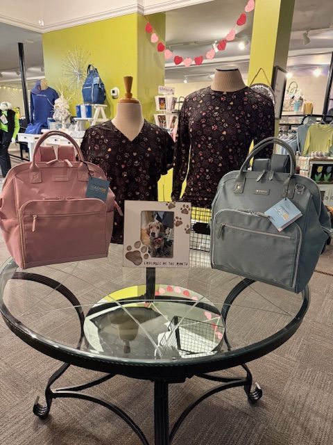 A table with a pillow that says happy pumpkin on it