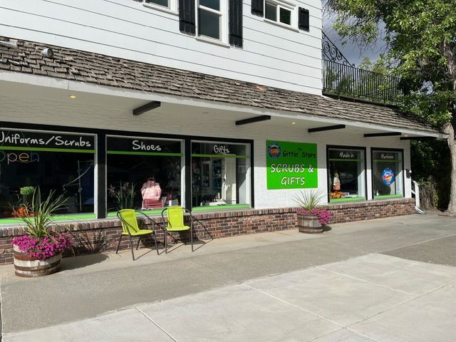 A store front with a green sign that says serious gifts